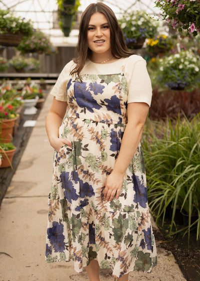 Thin straps on a cream floral dress
