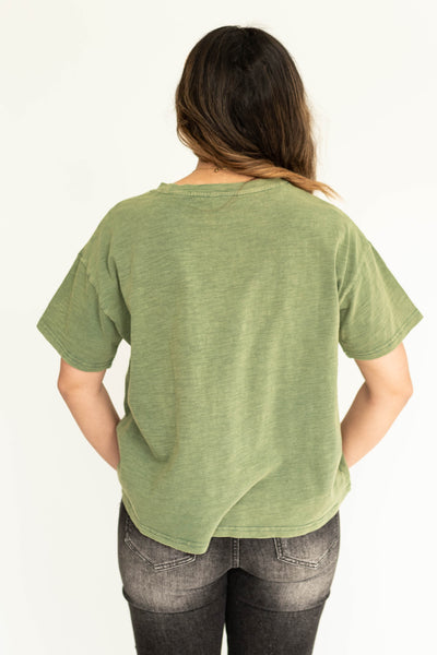 Back view of a bright sage knit top