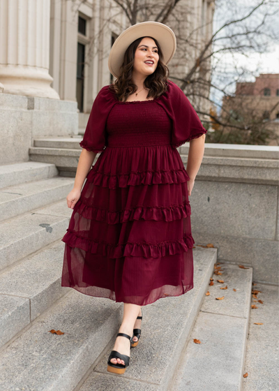Plus size burgundy tiered dress with short sleeve and ruffle at the cuff