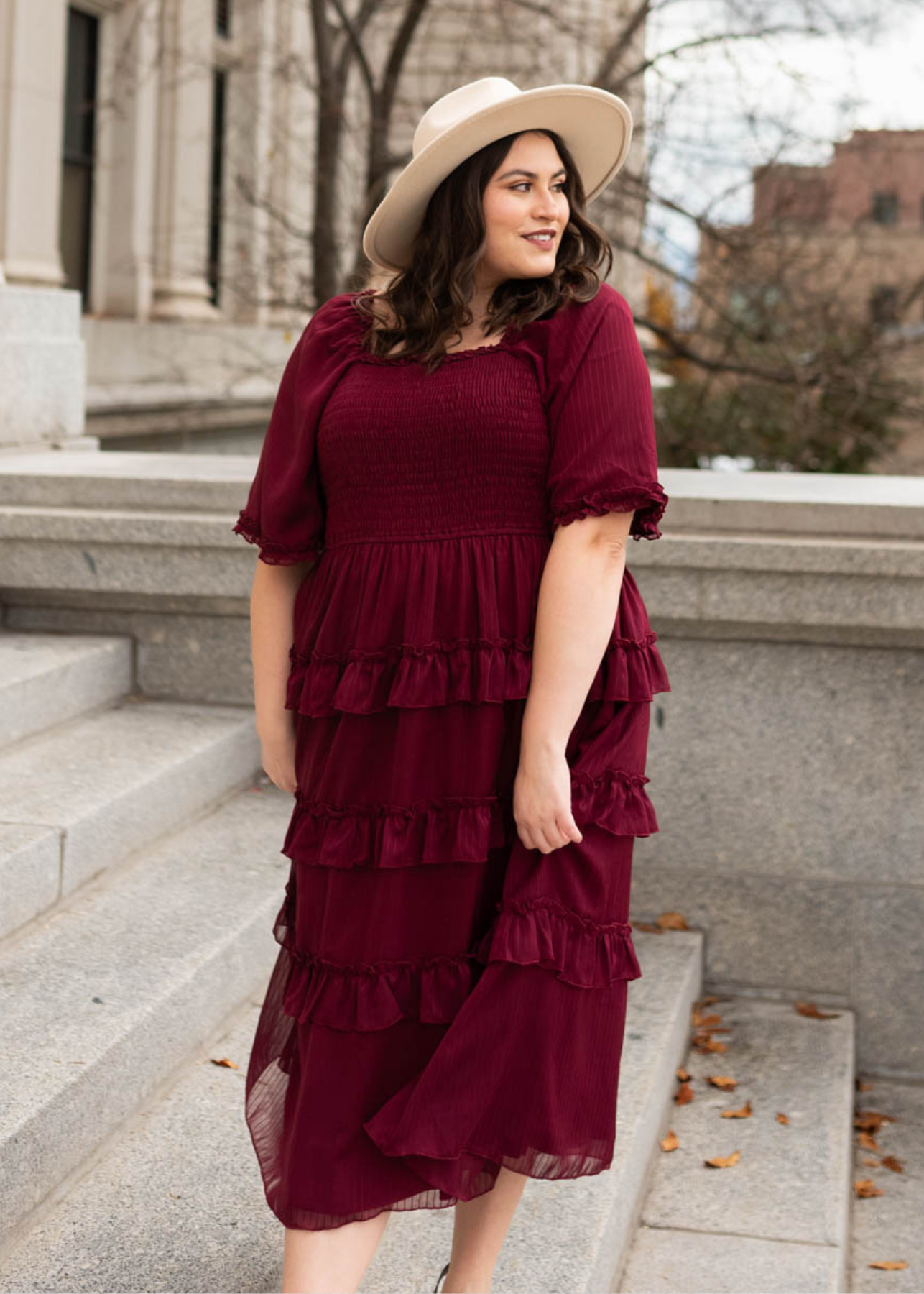 Plus size burgundy tiered dress with ruffles on the skirt