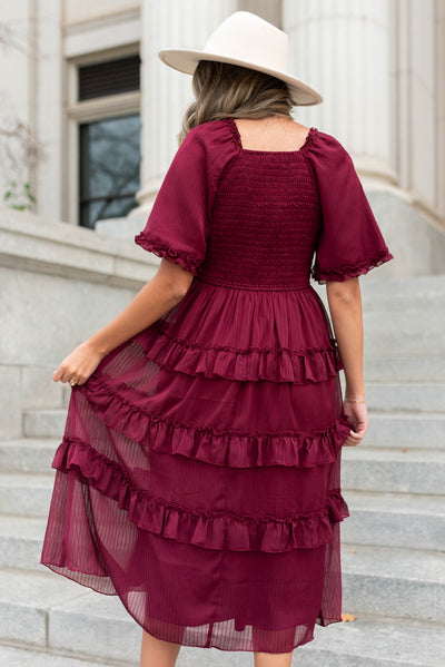 Back view of a burgundy tiered dress