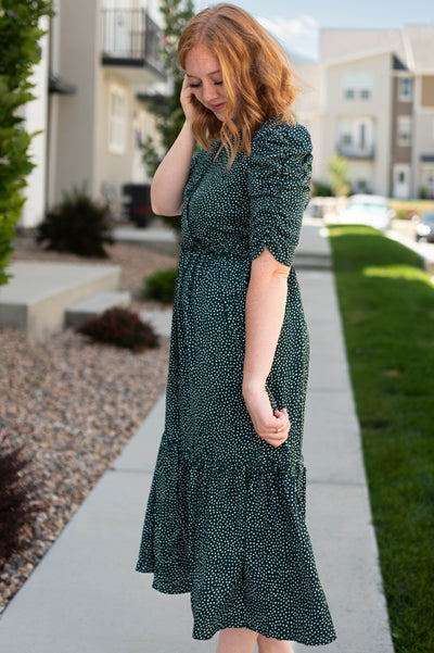 Side view of a hunter green dress
