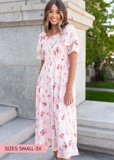 Blush watercolor floral dress with elastic waist and short sleeves