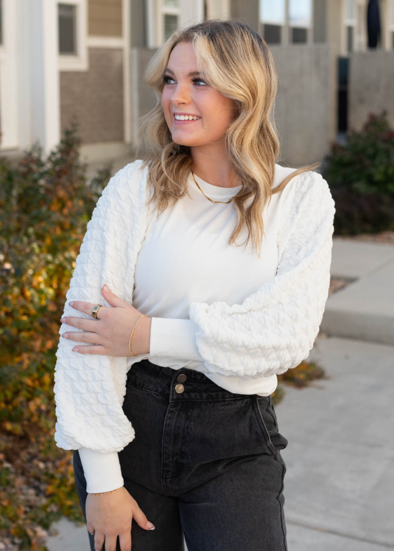 Textured long sleeves on a ivory top