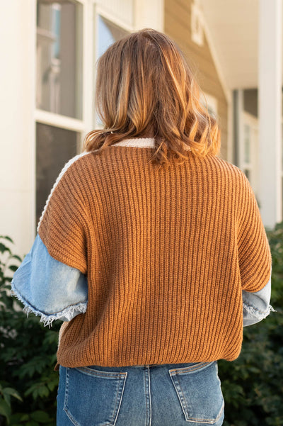 Back view of a taupe sweater