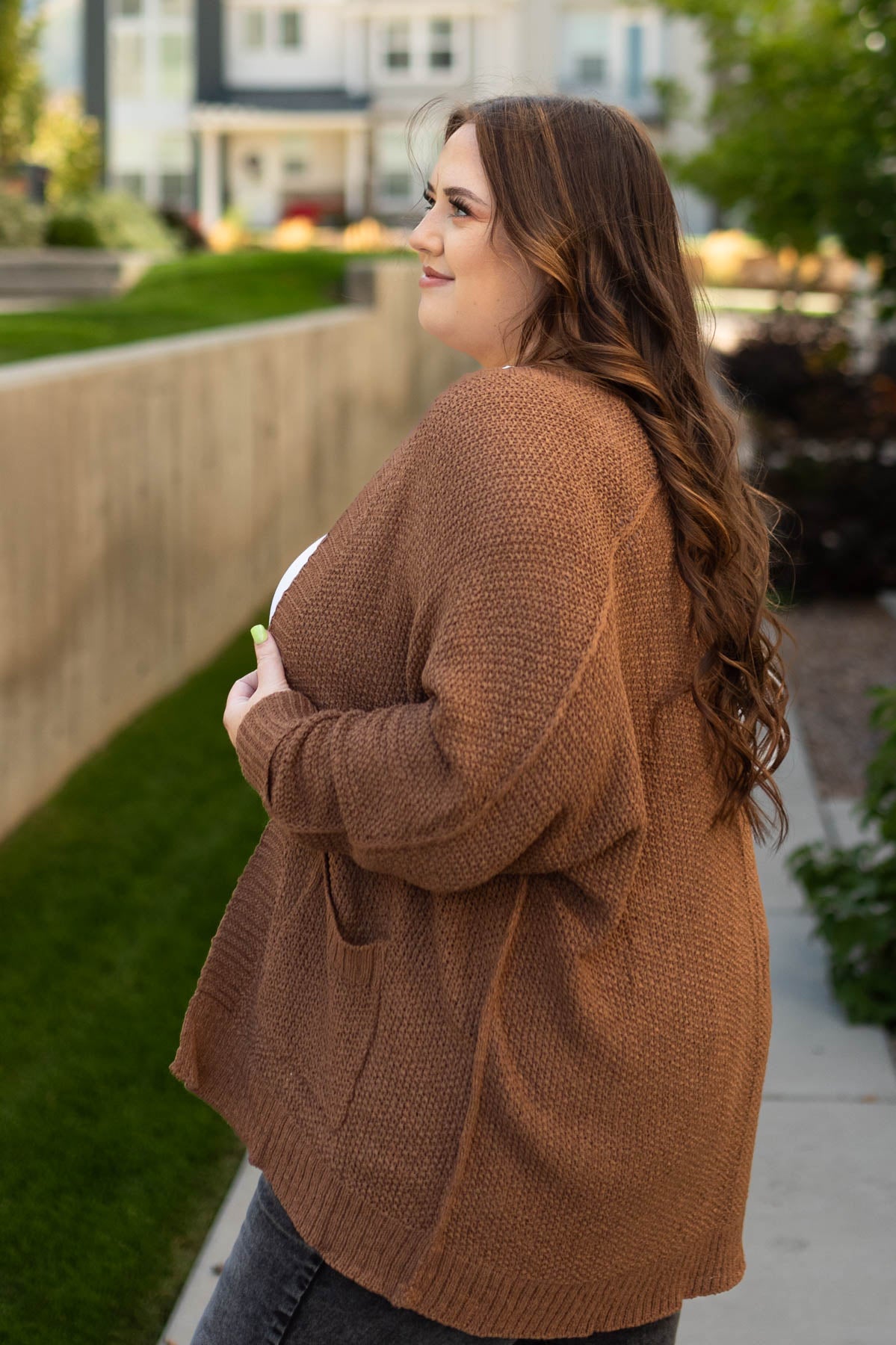 Side view of a plus size coco cardigan