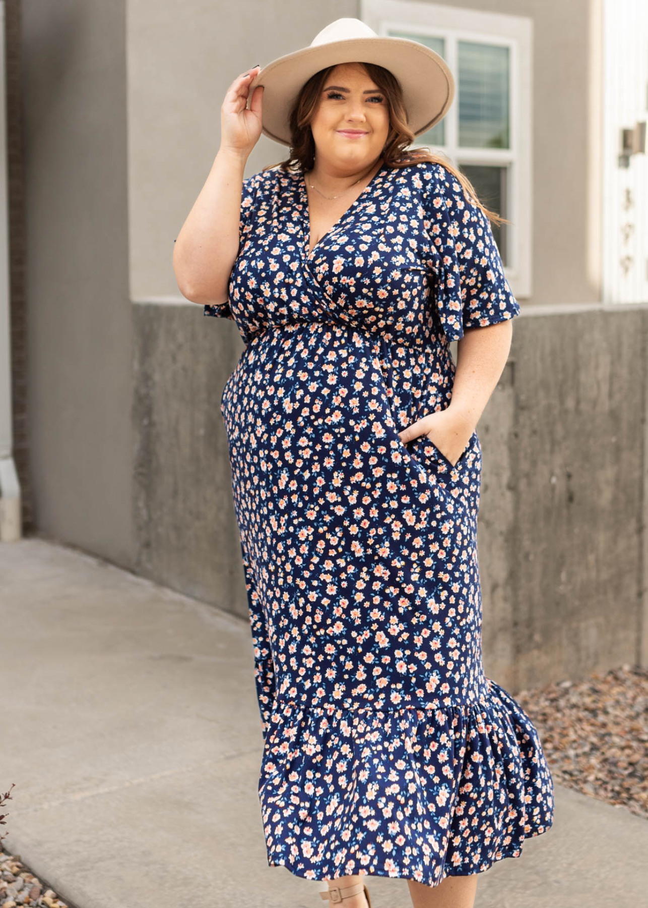 Plus size navy floral dress with ruffle at the bottom