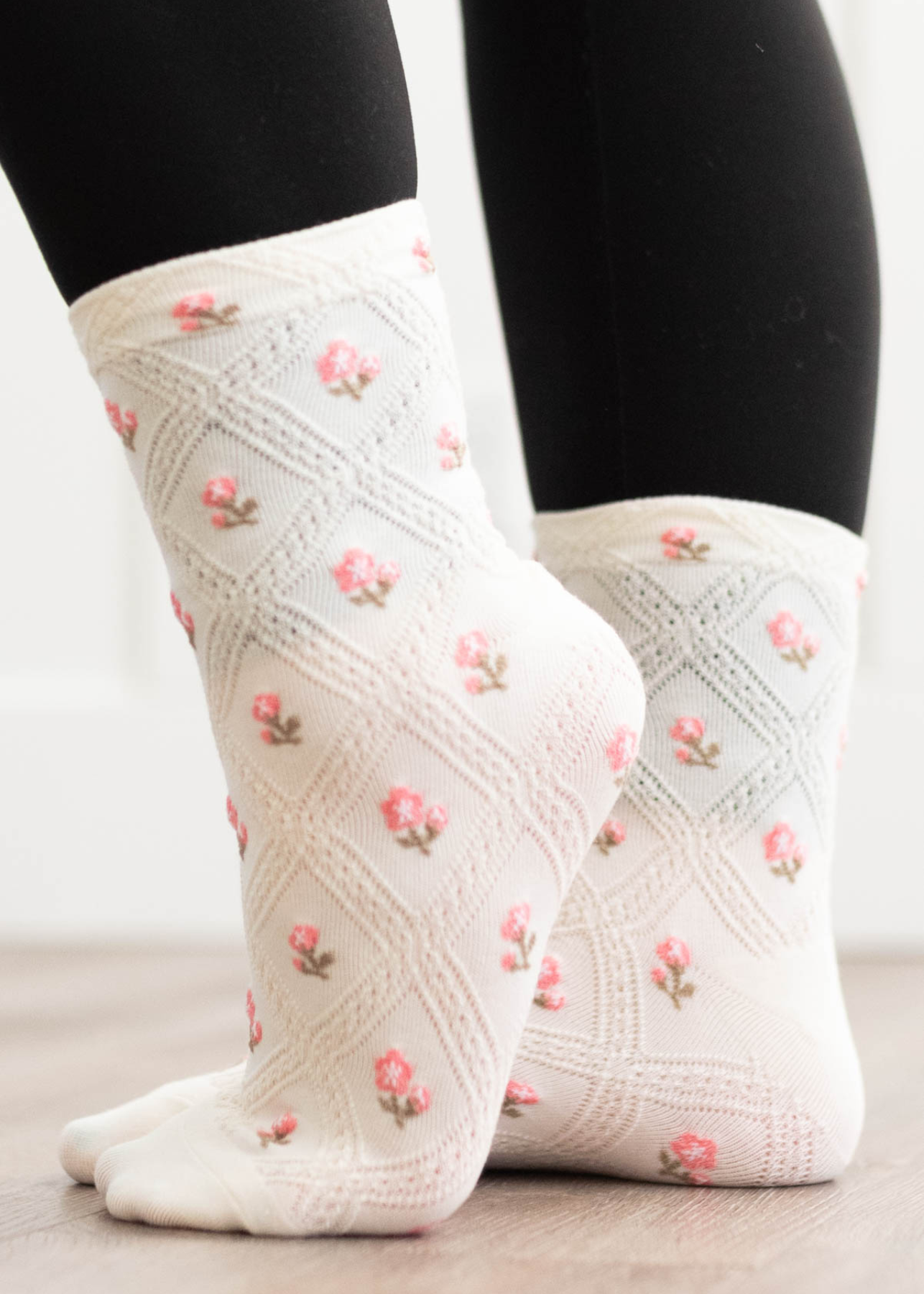 Side view of the cream flower socks