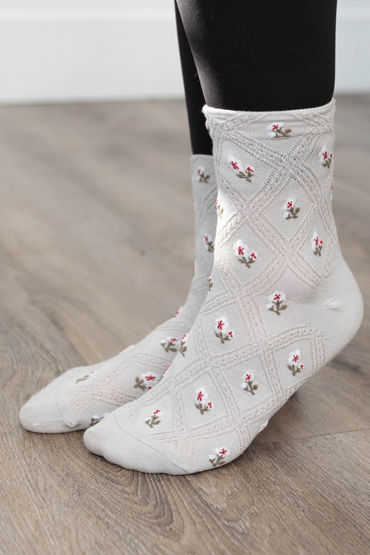 Side view of grey flower socks