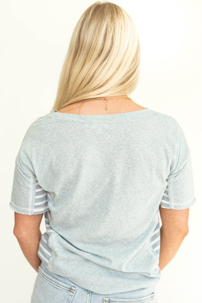 Back view of a short sleeve soft blue top.