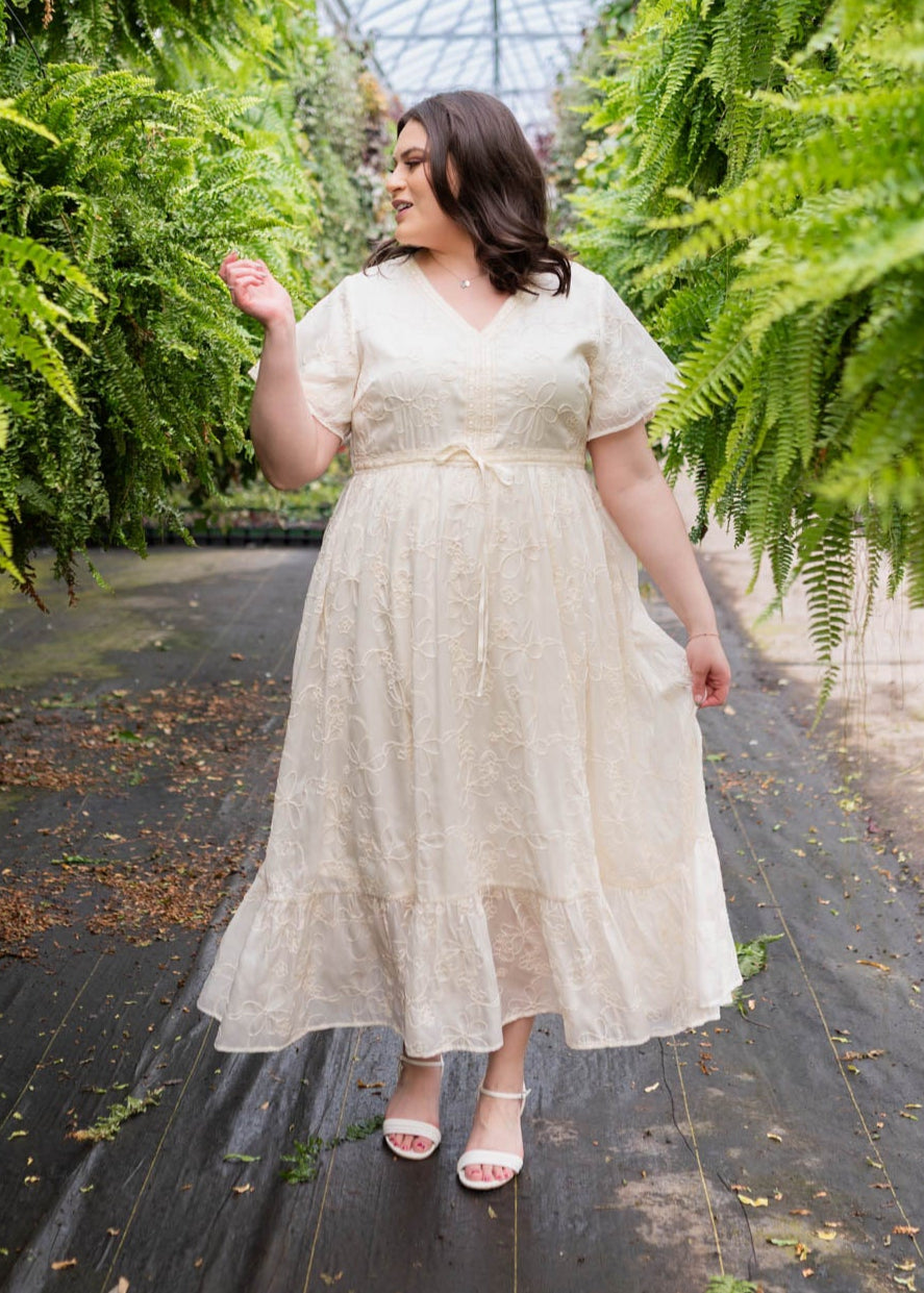 Plus size cream embroidered floral dress with ruffle at the hem
