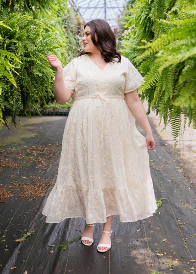 Plus size cream embroidered floral dress with ruffle at the hem