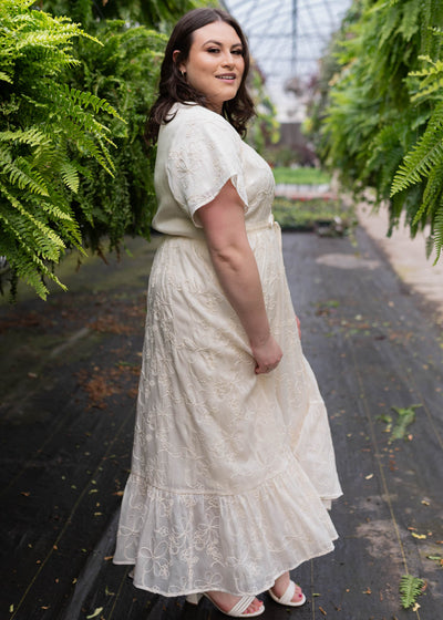Side view of the plus size cream embroidered floral dress
