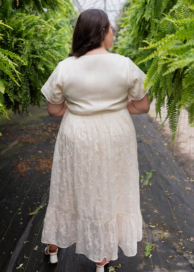 Back view of the cream embroidered floral dress in plus size