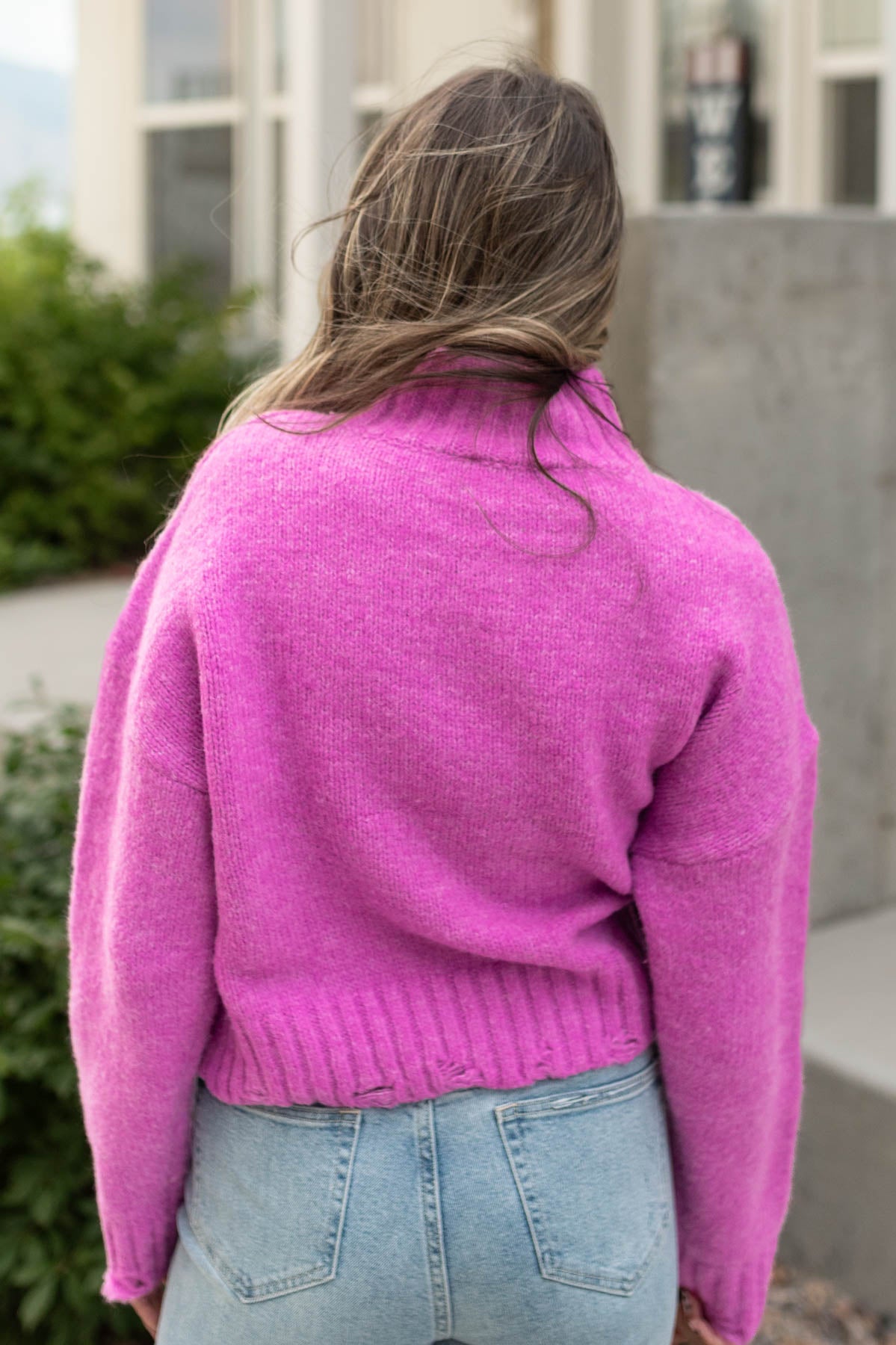 Back view of a orchid sweater
