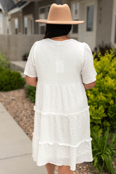 Back view of a short sleeve plus size white dress
