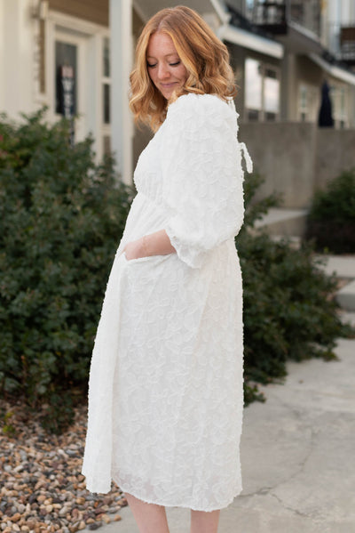 Side view of a white floral dress