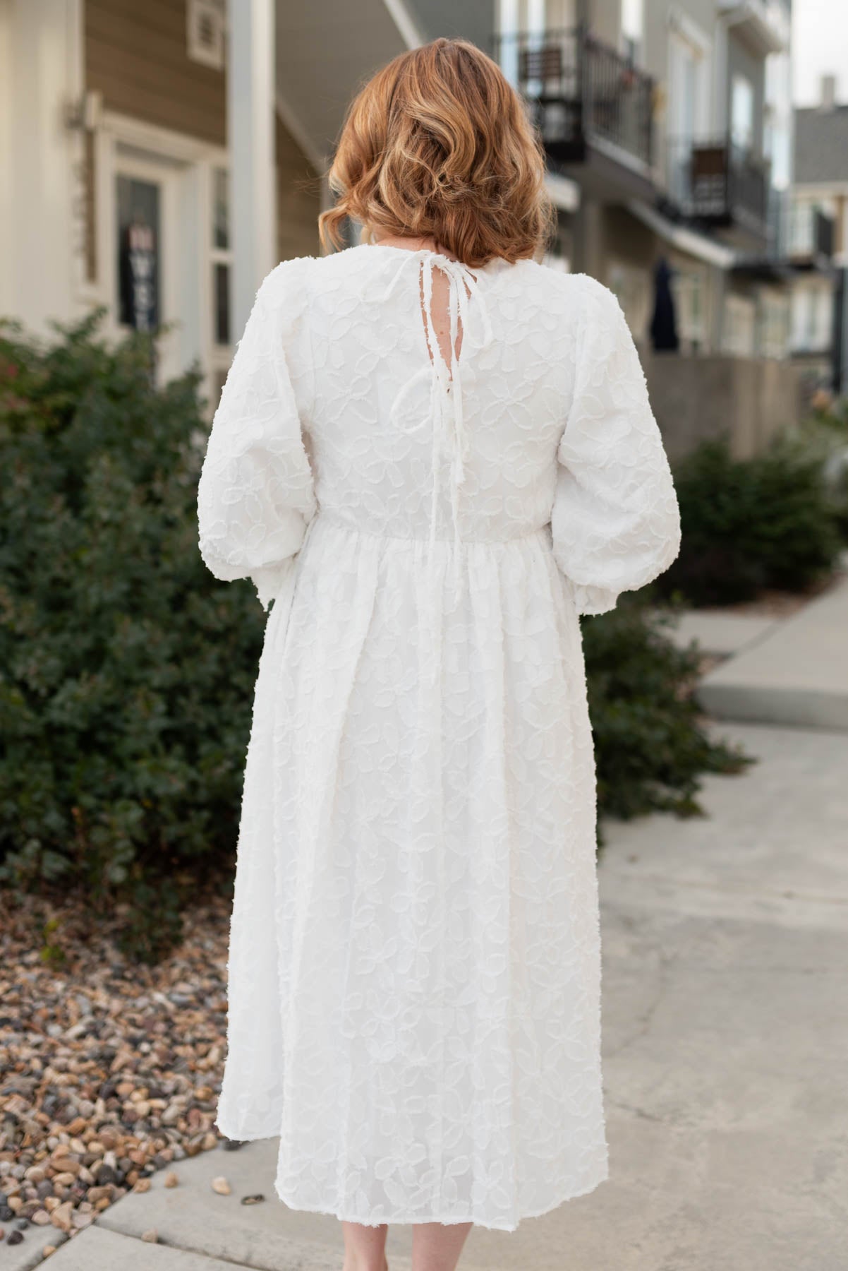 Back view of a white floral dress