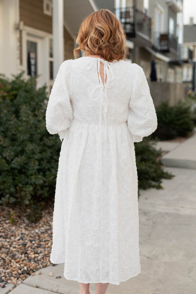 Back view of a white floral dress