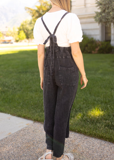 Back view of a black crop jumpsuit