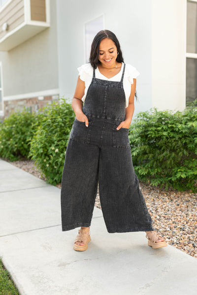 Black jumpsuit with wide legs