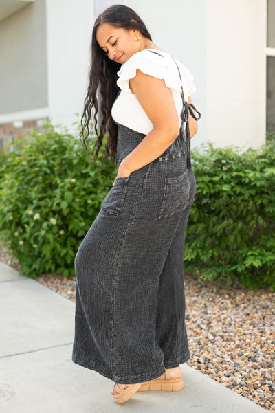 Side view of a black jumpsuit