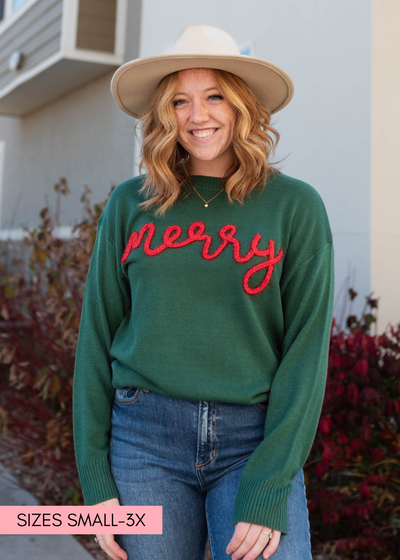 Front view of the long sleeve merry green crewneck sweater