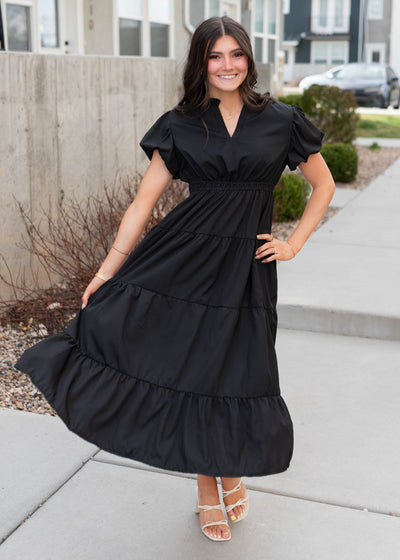 Black puff sleeve dress with tiered skirt