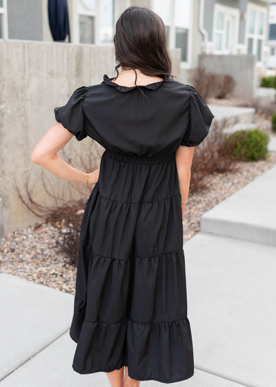 Back view of the black puff sleeve dress