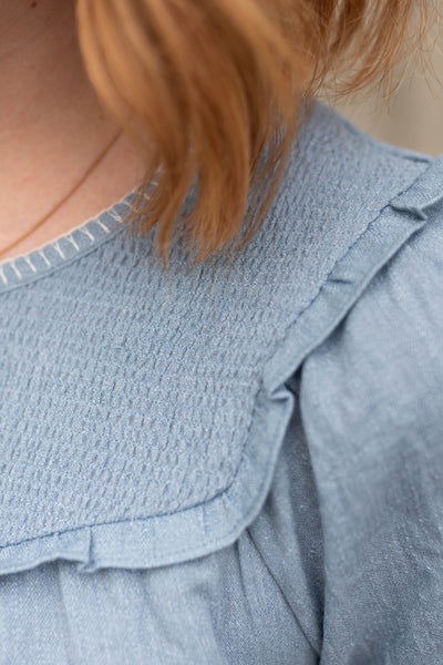 Chambray top with smocking at the neck