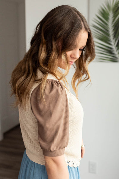 Side view of the oatmeal crochet vest