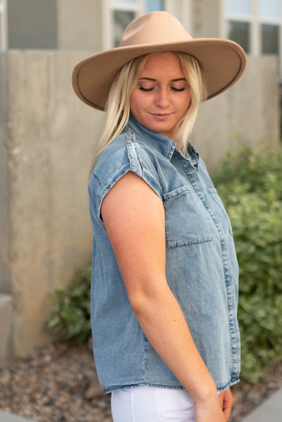 Side view of a light denim top