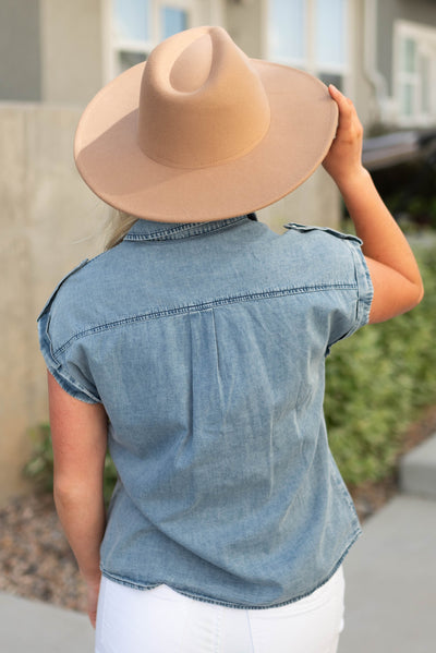Back view of a light blue denim top