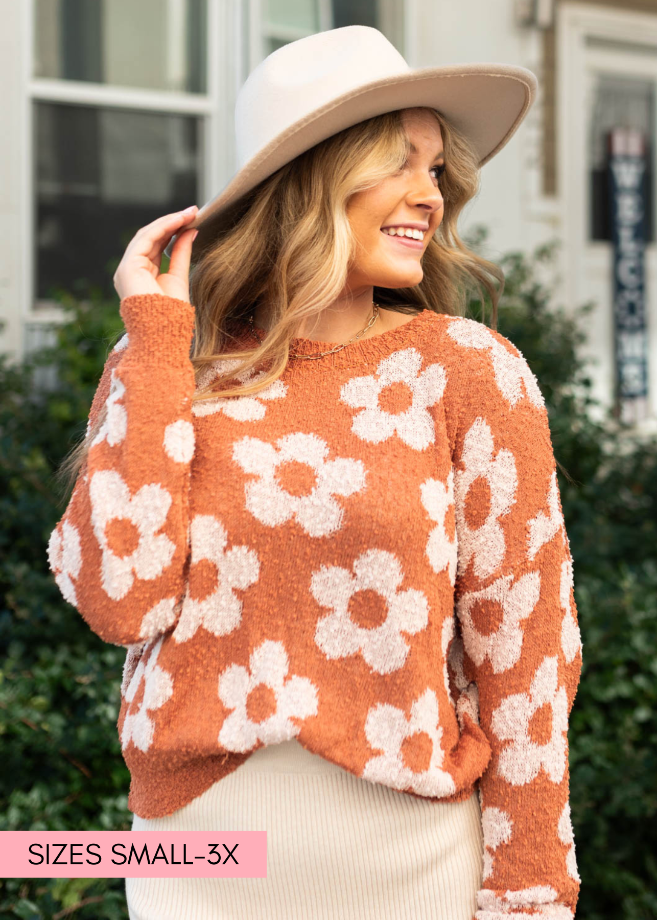 Caramel sweater with a daisy print