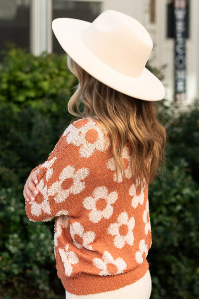 Side view of a caramel sweater