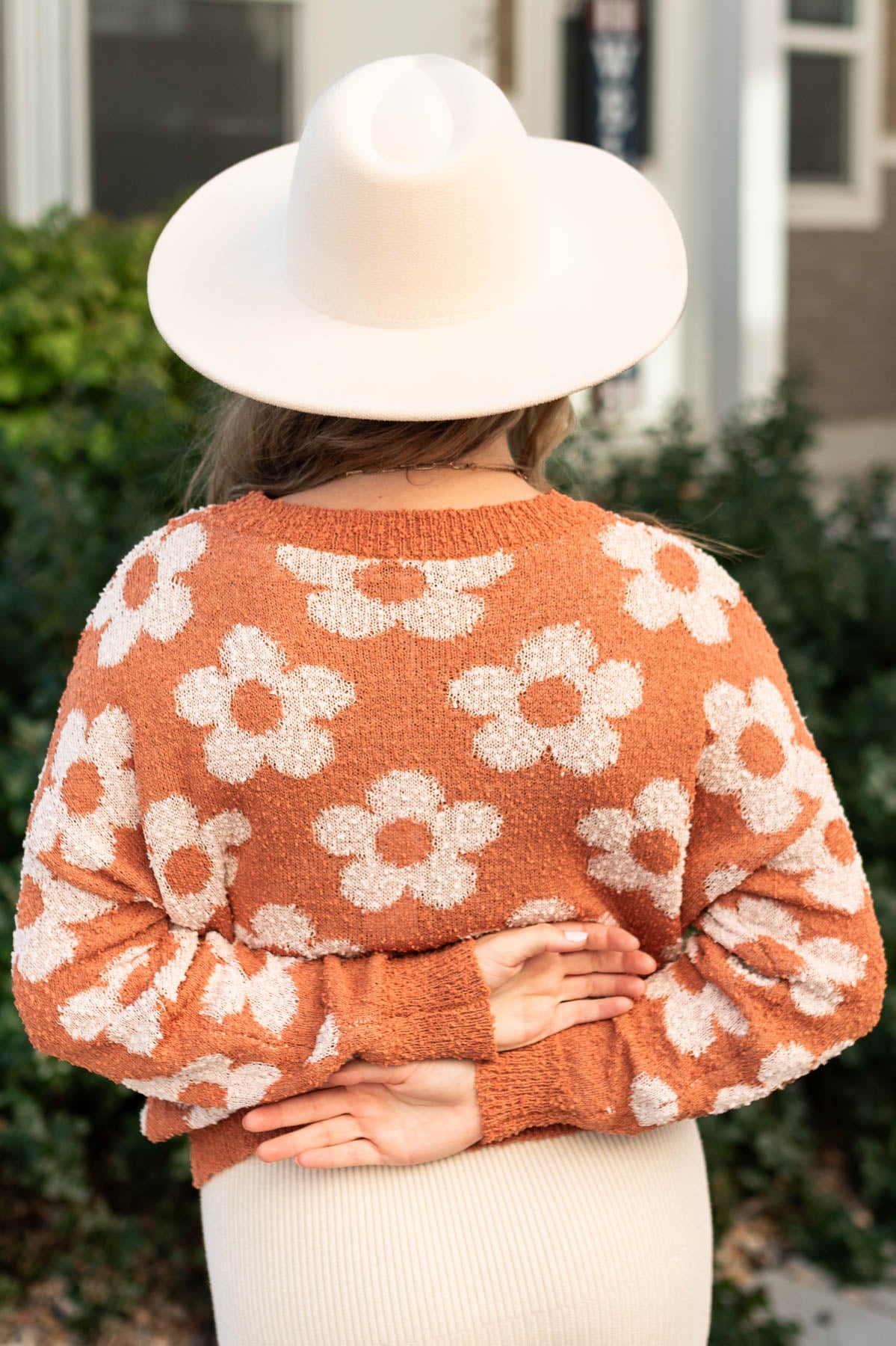 Back view of a caramel sweater