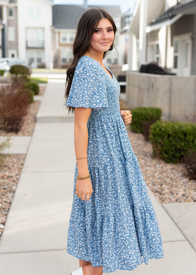 Side view of the blue smocked floral dress