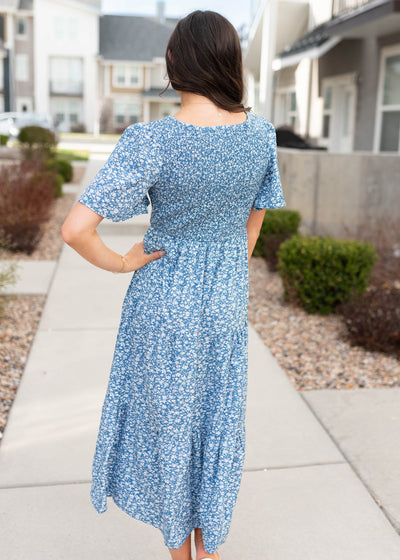 Back view of the blue smocked floral dress