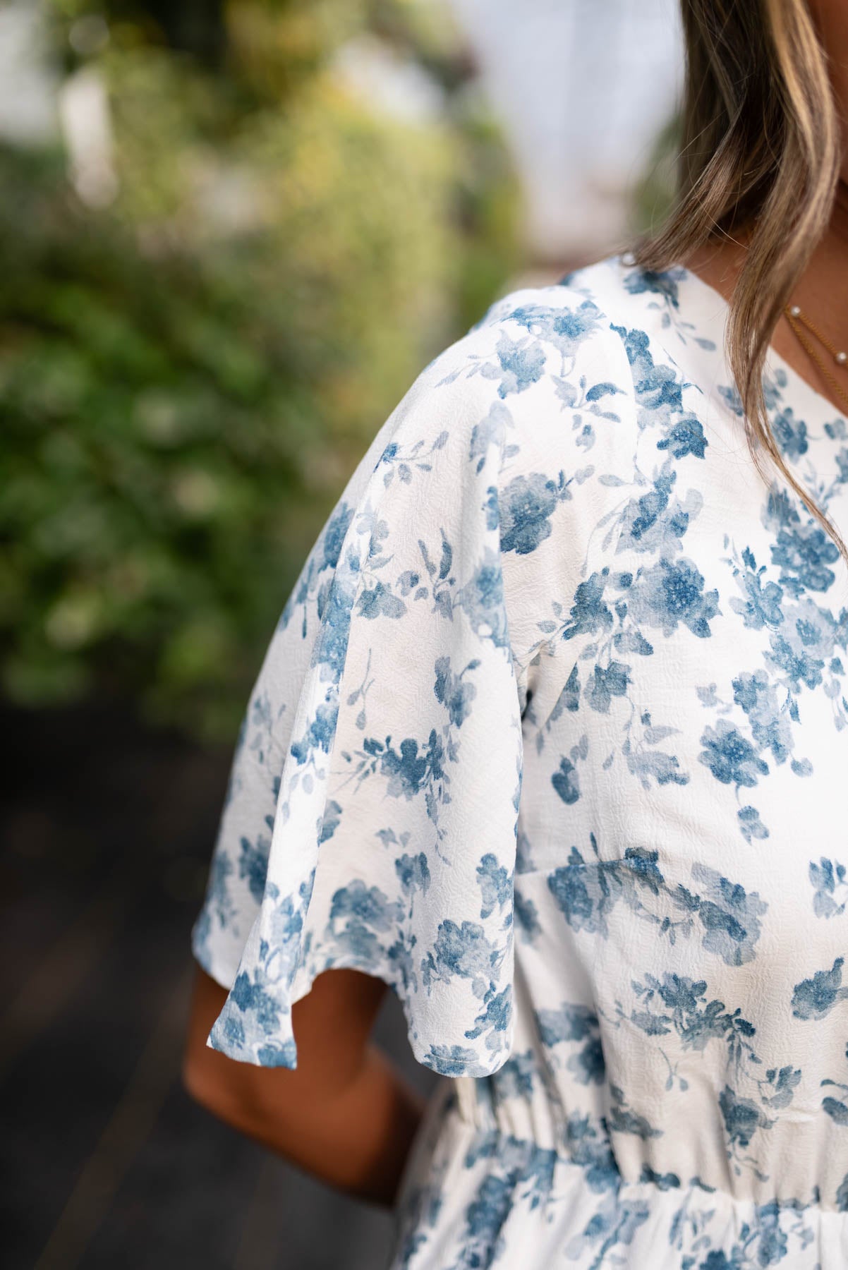 Close up of the fabric on the ivory blue floral dress