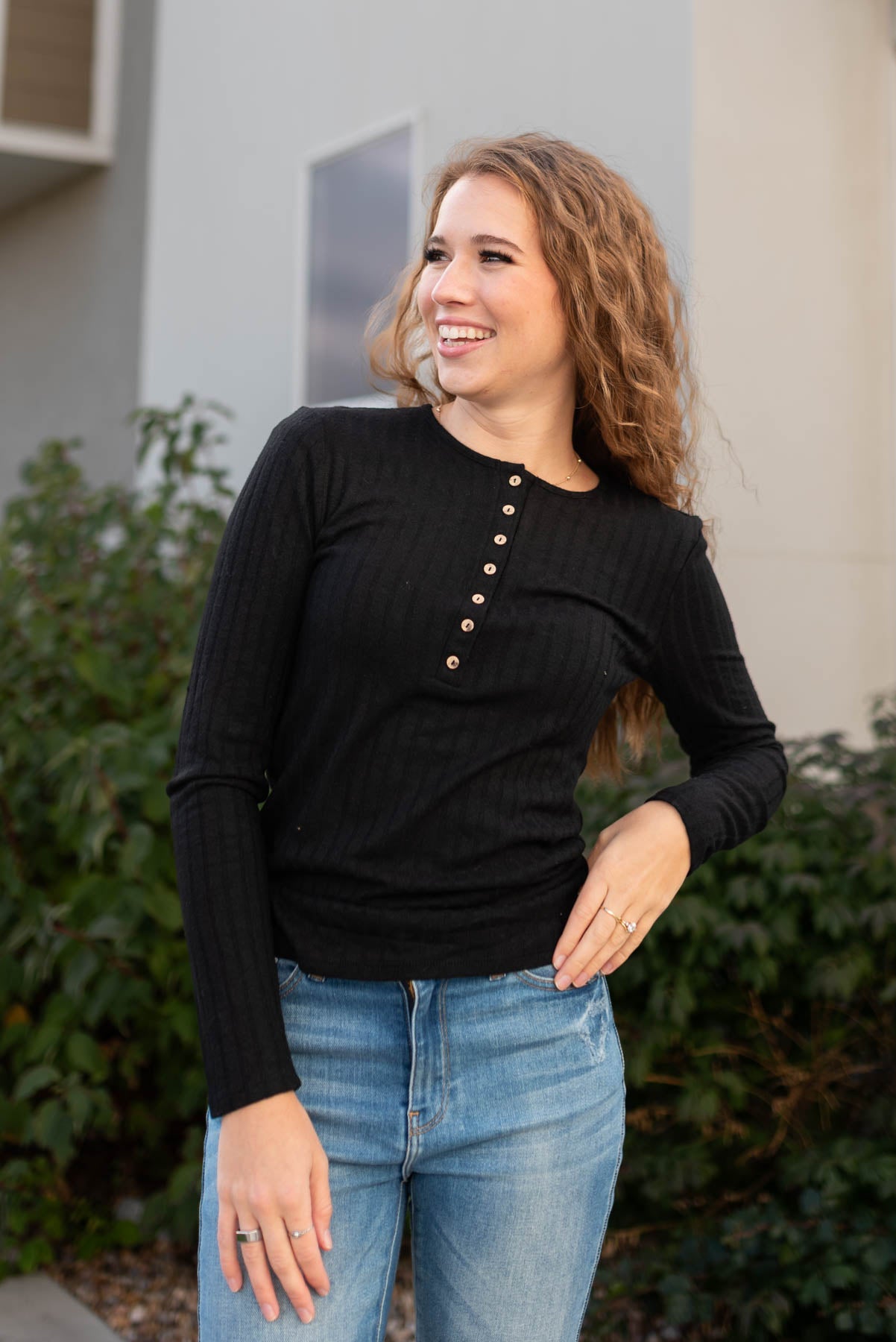 Long sleeve with buttons on a black ribbed long sleeve top