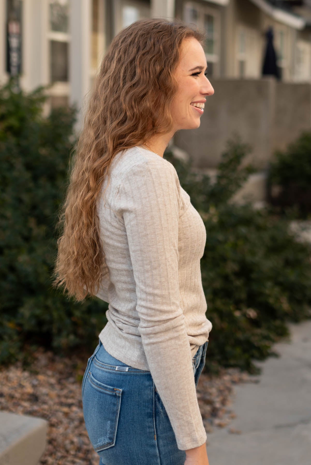 Side view of a mocha ribbed long sleeve top