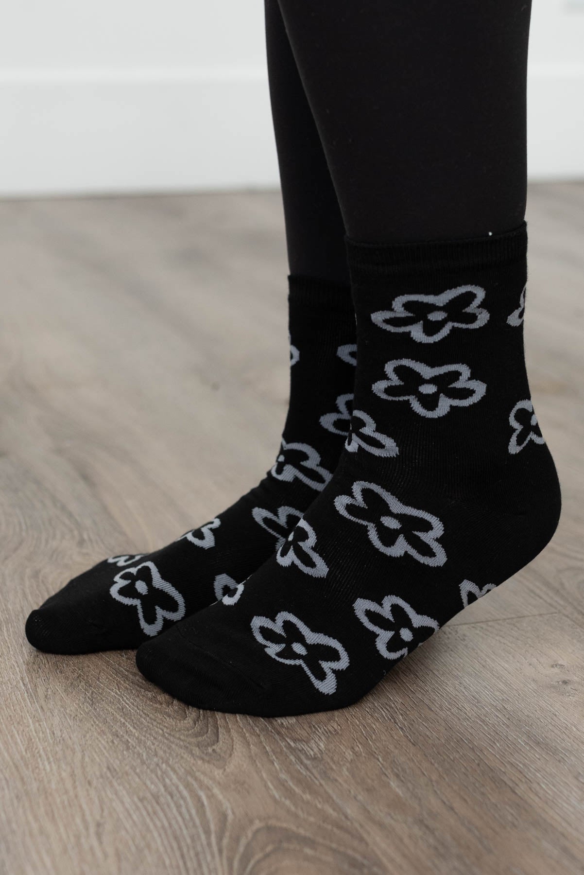 Side view of black flower socks