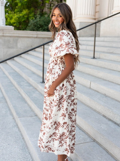 Side view of the mocha floral tiered dress with smocked bodice