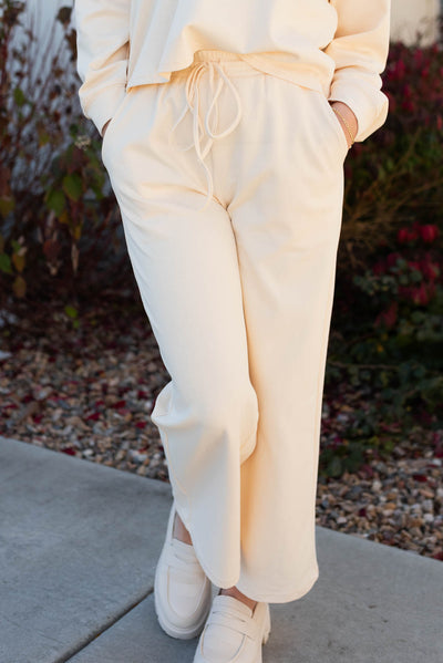 Pants of the cream lounge set with pockets and ties at the waist