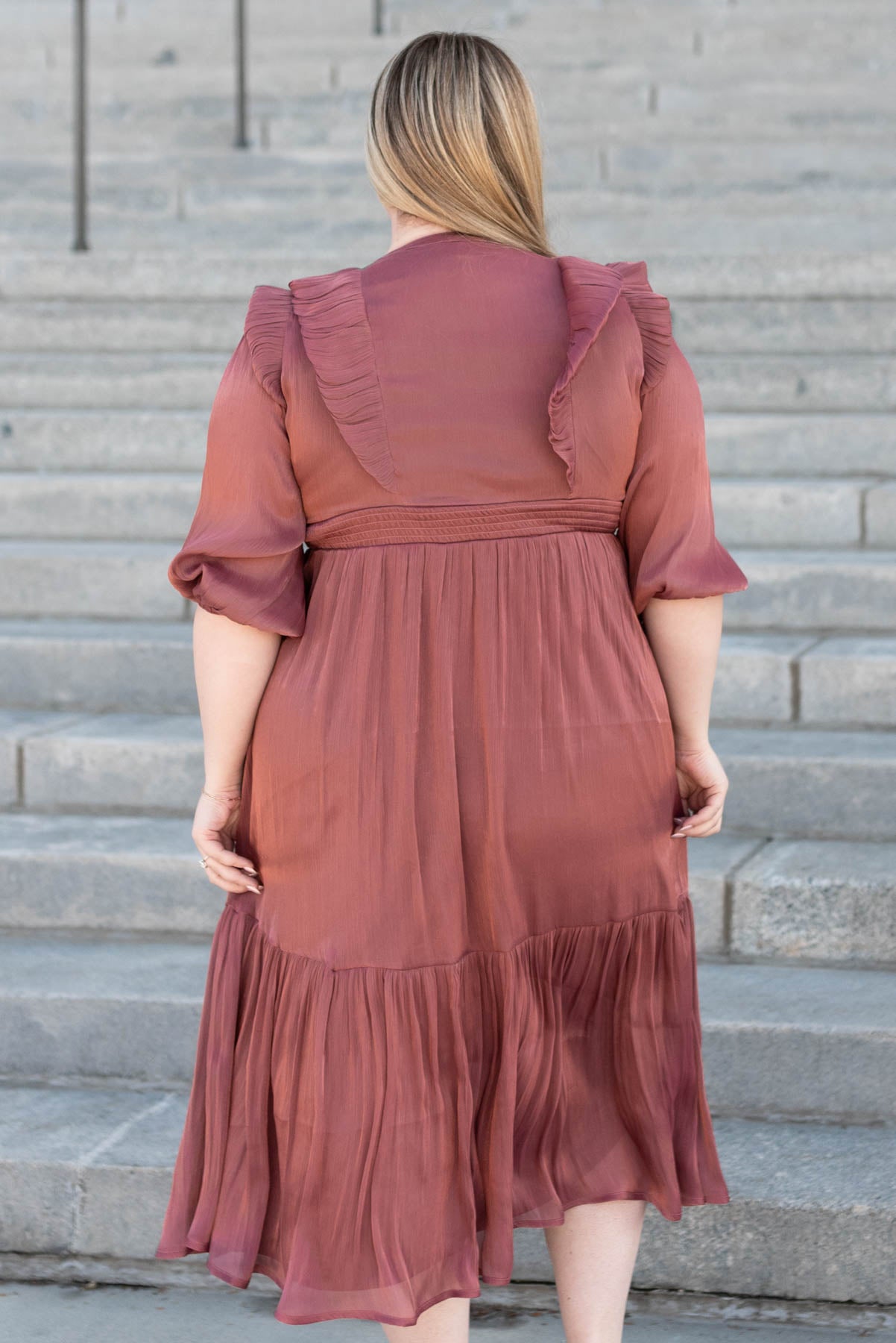 Back view of the plus size mahogany layered dress
