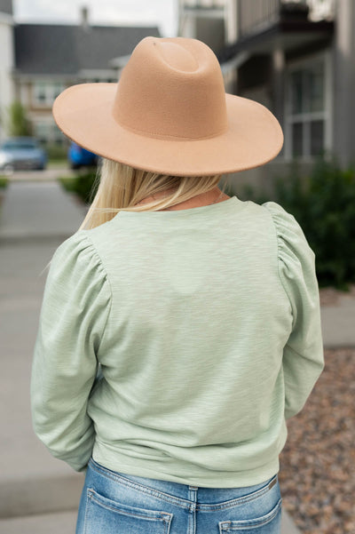 Back view of a sage sweatshirt