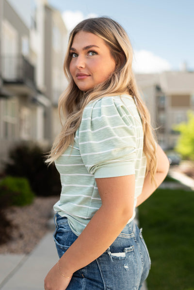 Side view of a sage stripe top