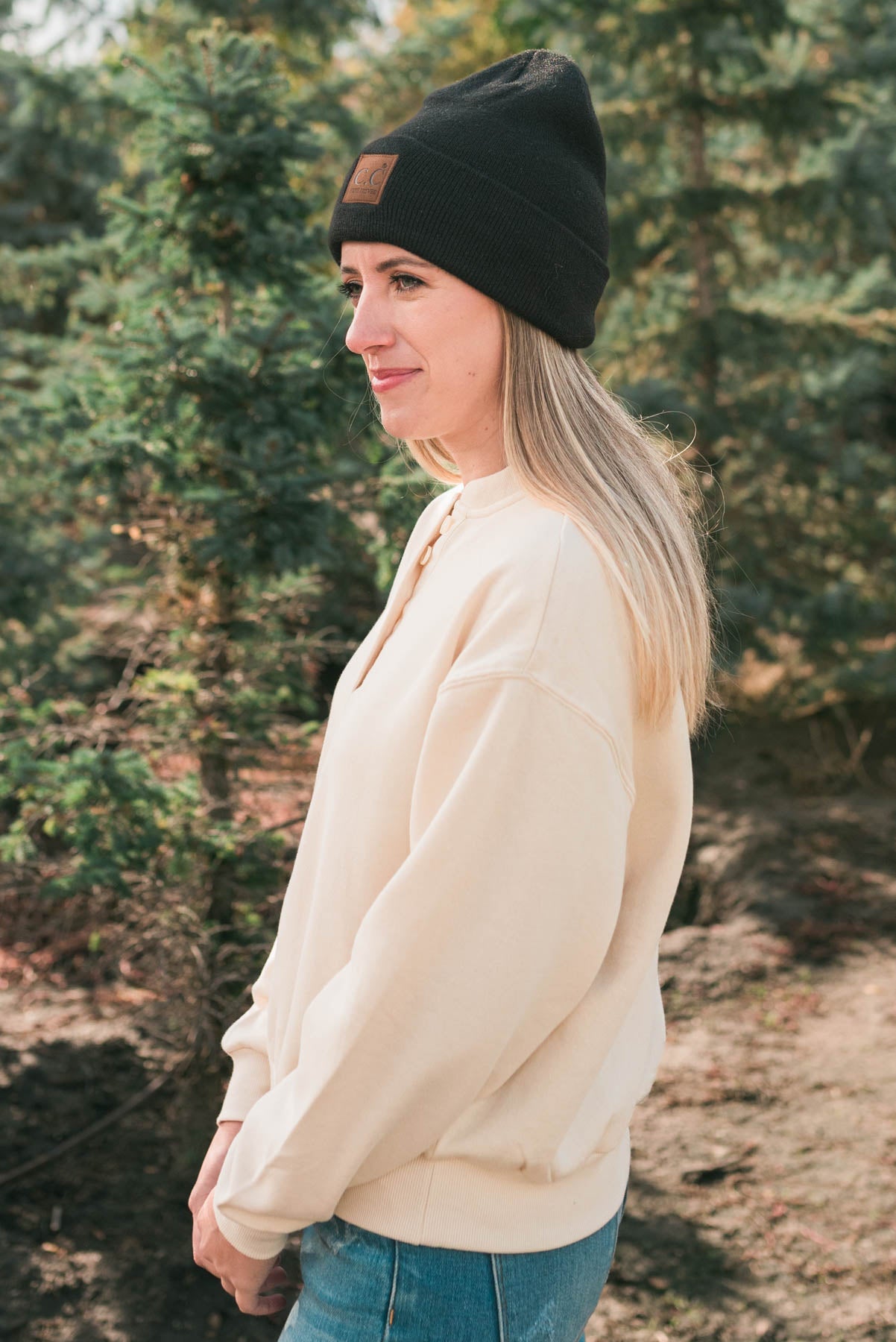 Side view of a cream fleece sweatshirt