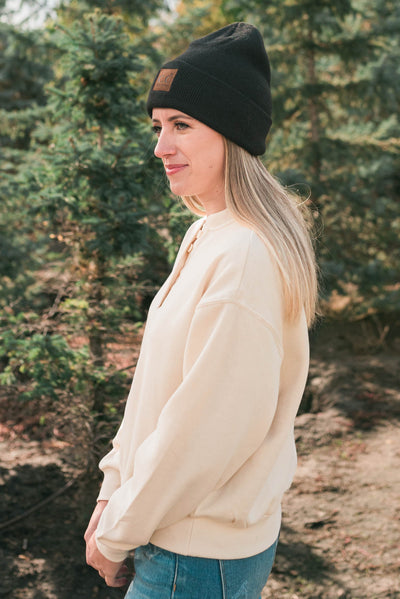 Side view of a cream fleece sweatshirt