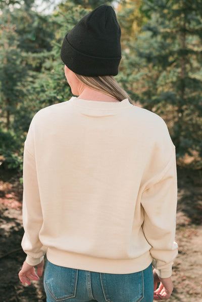 Back view of a cream fleece sweatshirt